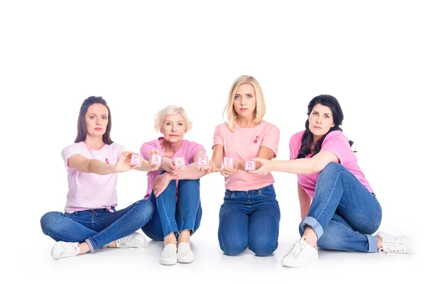 Women in pink t-shirts with cancer inscription — Stock Photo
