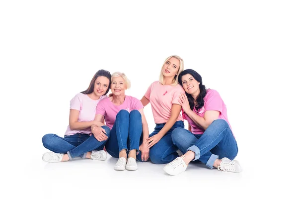 Women in pink t-shirts with ribbons — Stock Photo