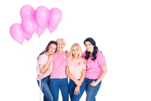 Mujeres con globos rosados - foto de stock