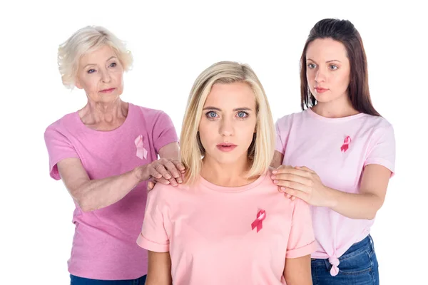 Women in pink t-shirts with ribbons — Stock Photo