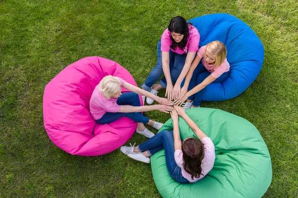 Women on bean bag chairs — Stock Photo