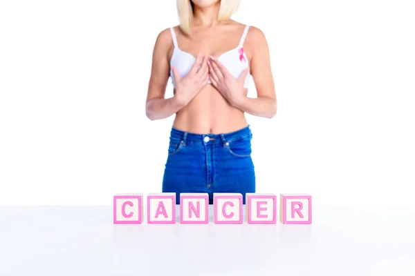 Woman in bra and cancer inscription — Stock Photo