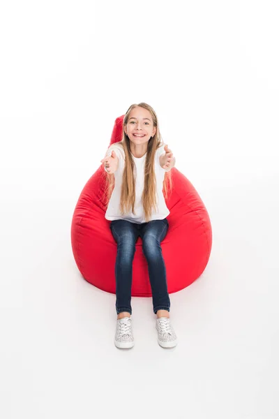 Youngster sitting in bean bag chair — Stock Photo