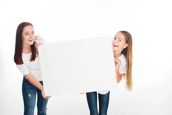 Daughter and mother with banner — Stock Photo