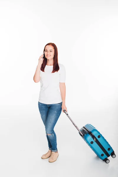 Traveler with luggage and smartphone — Stock Photo