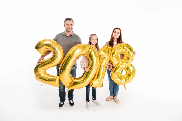 Famiglia con palloncini durante anno nuovo — Foto stock