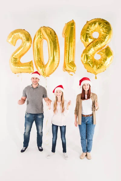 Famiglia con palloncini durante anno nuovo — Foto stock