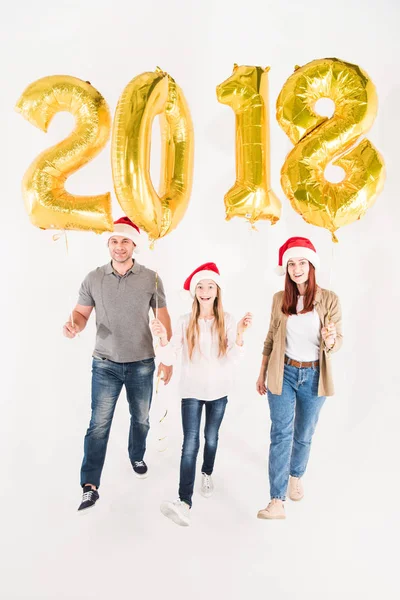 Family with balloons for new year — Stock Photo