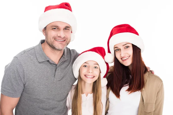 Familie mit Weihnachtsmann-Hüten — Stockfoto