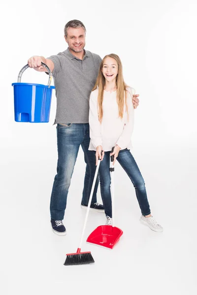 Family cleaning with broom — Stock Photo