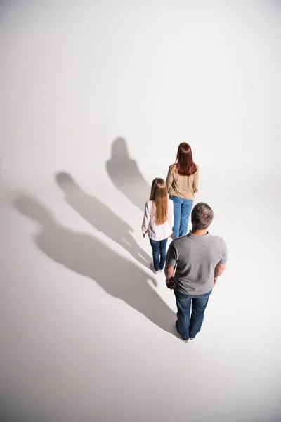 Young family with shadows — Stock Photo