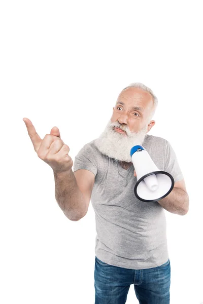 Senior man with loudspeaker pointing to something — Stock Photo