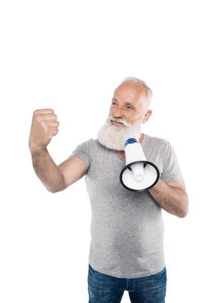 Senior man with loudspeaker showing fist — Stock Photo