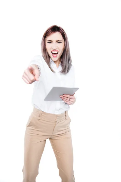 Angry businesswoman with tablet — Stock Photo