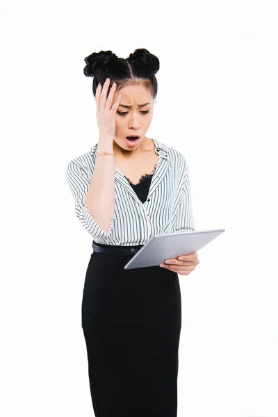 Shocked businesswoman using tablet — Stock Photo