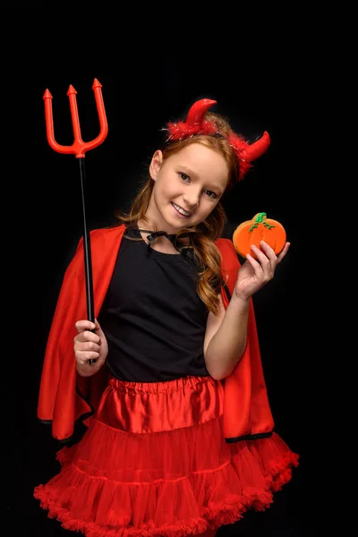 Devil with pitchfork and cookie — Stock Photo