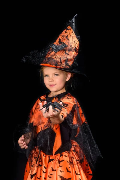 Little witch holding spider — Stock Photo