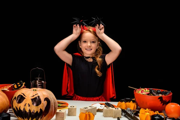 Little devil with spiders — Stock Photo