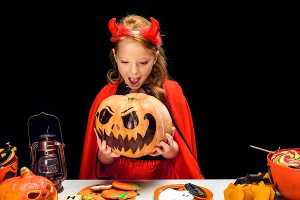 Little devil with jack o lantern — Stock Photo