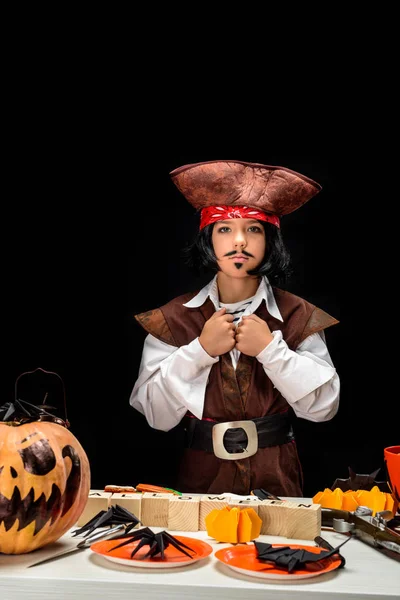 Little pirate with halloween decorations — Stock Photo