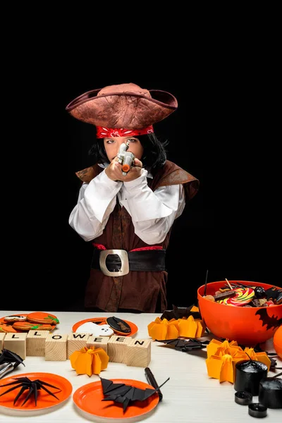 Little pirate with halloween decorations — Stock Photo