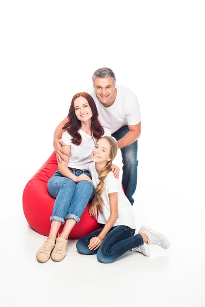 Family on bean bag chair — Stock Photo