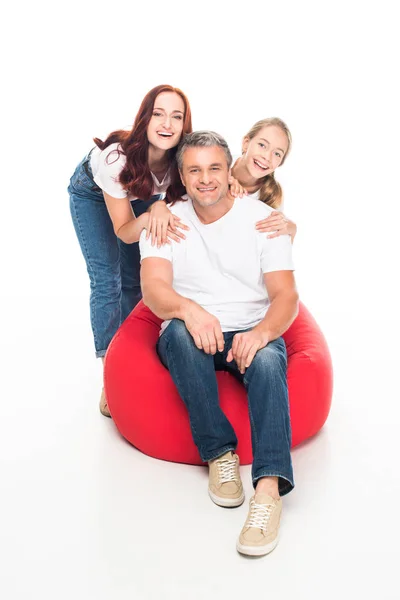 Family sitting on bean bag chair — Stock Photo