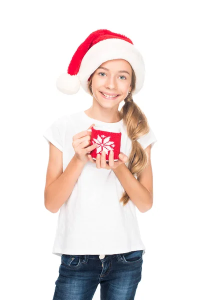 Teenager in Santa hat with coffee — Stock Photo