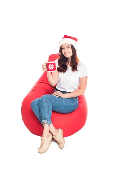Woman in Santa hat with coffee — Stock Photo
