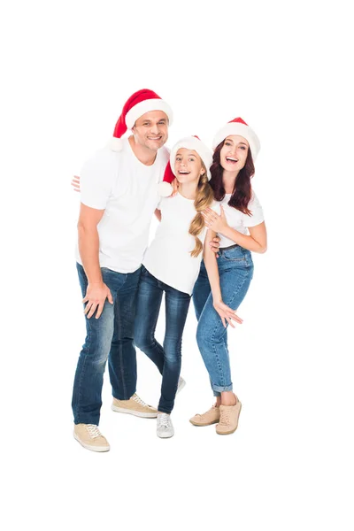 Embrasser la famille dans les chapeaux de Père Noël — Photo de stock