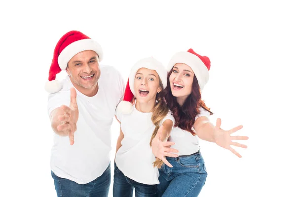 Happy family in Santa hats — Stock Photo