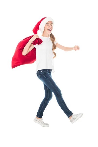 Adolescente santa con bolsa de Navidad - foto de stock