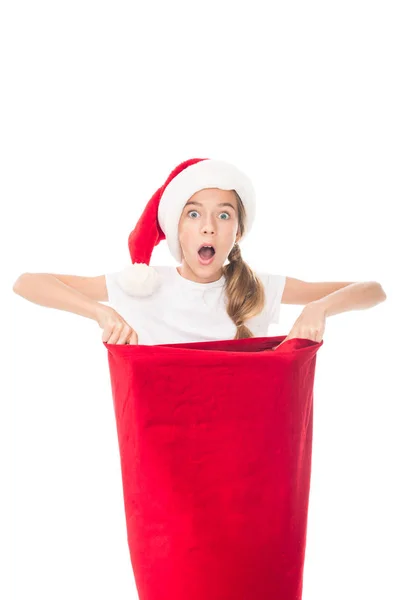 Sorprendido adolescente con bolsa de Navidad - foto de stock