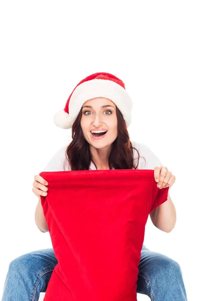 Woman in Santa hat with bag — Stock Photo