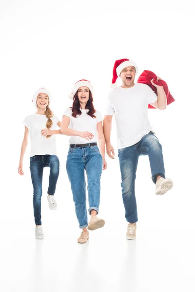 Familia en sombreros de santa — Stock Photo