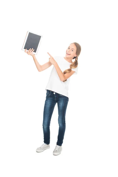 Teenager pointing at digital tablet — Stock Photo