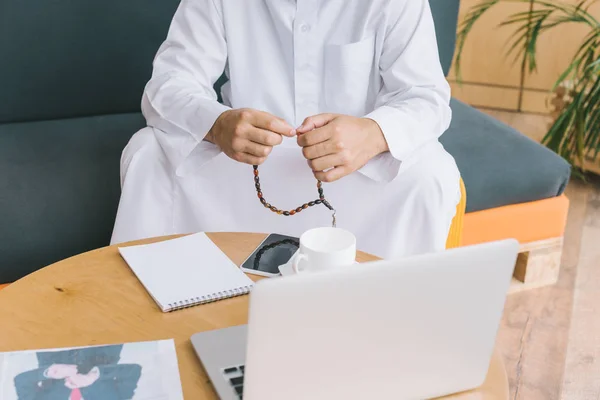 Muslim man with prayer beads — Stock Photo