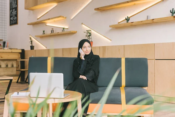 Muslim woman talking by phone — Stock Photo