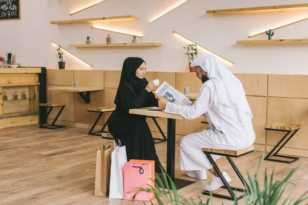 Muslim couple spending time in cafe — Stock Photo