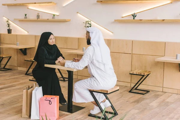 Muslim couple spending time in cafe — Stock Photo