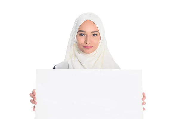 Muslim woman holding blank board — Stock Photo