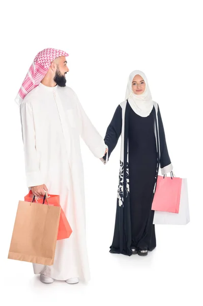 Muslim couple with shopping bags — Stock Photo