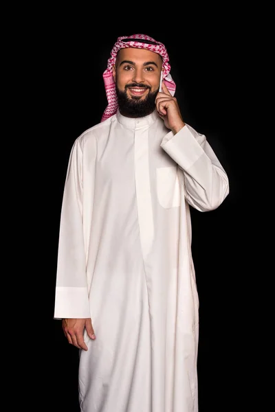 Muslim man talking by phone — Stock Photo