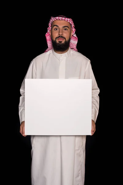Muslim man holding blank board — Stock Photo