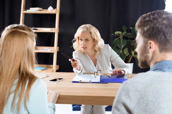 Young couple and psychologist — Stock Photo