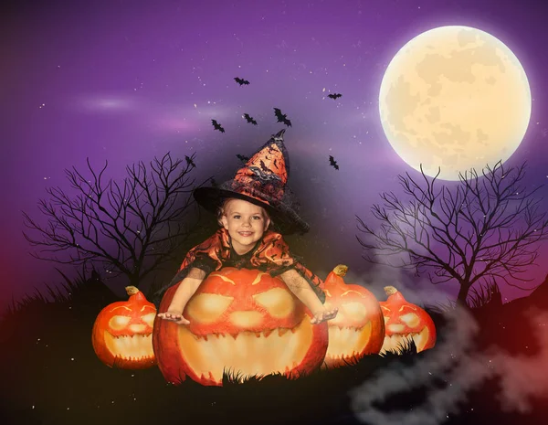 Witch on big jack o lantern — Stock Photo