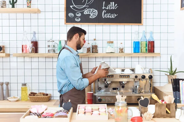 Barista cleaning utensil — Stock Photo