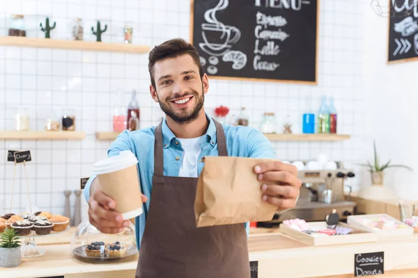 Barista with coffee to go — Stock Photo