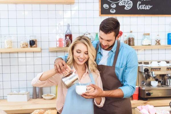 Cafe workers making coffee — Stock Photo