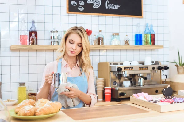 Waitress holding jug with milk — Stock Photo